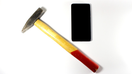 Red Hammer and mobile phone display, service - isolated