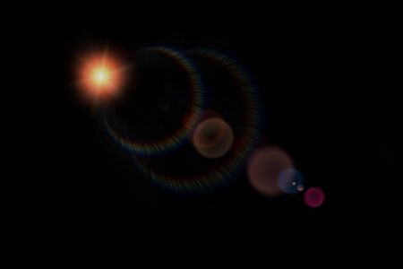Colorful light Lens flare on black background.の写真素材