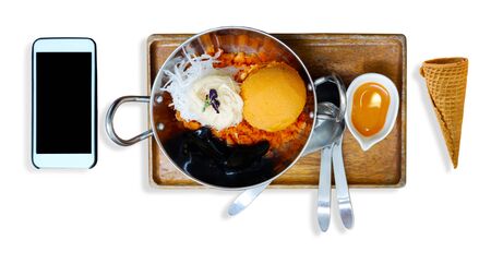 Thai tea ice cream served in stainless steel cups and wooden tray.