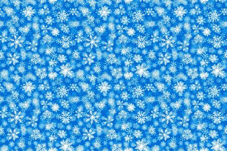 Pattern white snow flake drawing on blue background.の写真素材