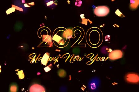 Text 2020 HAPPY NEW YEAR with golden ribbon on black background.