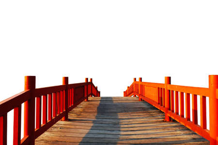 Red wooden bridge on white background.の写真素材