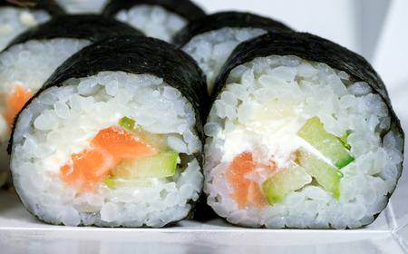 Maki with salmon rice cheese and cucumber sushi menu Japanese foodの写真素材