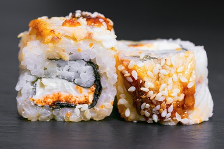 roll with rice eel cheese unagi sauce sesame caviar tobiko sushi menu Japanese foodの写真素材