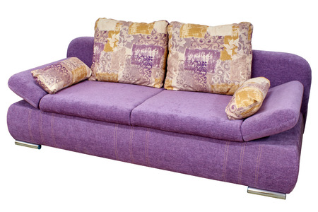modern stylish purple fabric sofa with pillows and armrests, which are adjustable on a white backgroundの写真素材