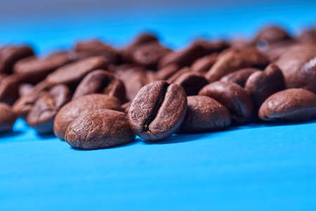 coffee beans close-up on a blue background