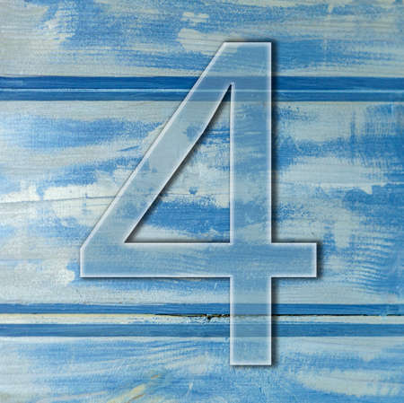 number four on wooden blue background photo