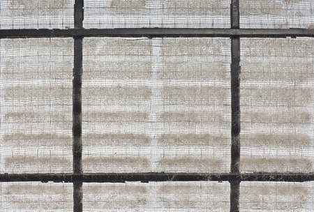 closeup of home air conditioner filter with many dust 