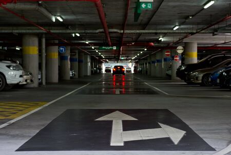 traffic arrow on the floor  of car park building