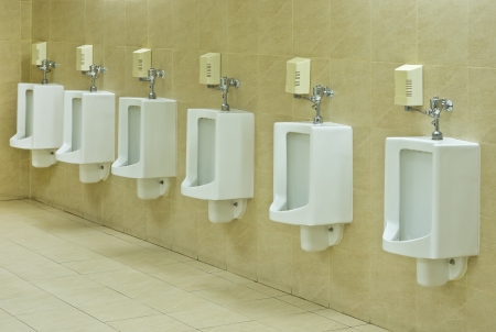  row of urinals in public restroomの写真素材