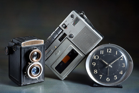 vintage camera cassette tape player and alarm clockの写真素材