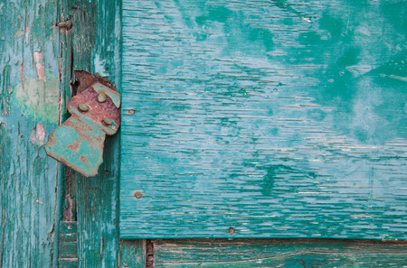 Grunge old wood panels ruined by weather with lockの写真素材