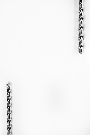 Drill bits of different sizes isolated over white background with copy spaceの写真素材