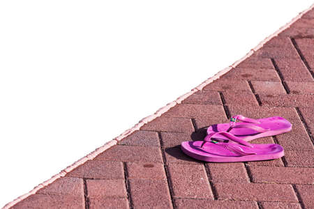 Purple flipflops on poolside in a sunny day in northern italyの写真素材