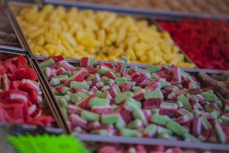 Colorful candies and jellies close up at the carnival marketの写真素材
