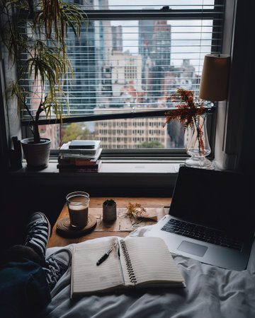 Journaling by Window with Laptop Viewの素材