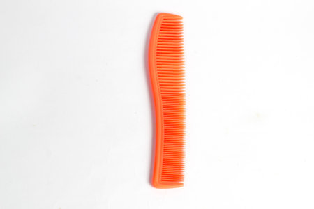 orange hair comb isolated on white background
