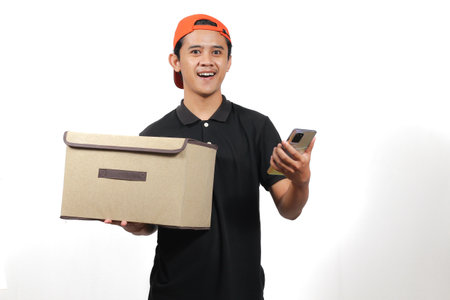 Delivery man holding cardboard boxes and mobile phone isolated on white background.