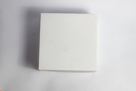 White paper box on white background. Top view. Copy space.