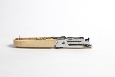 Old stapler isolated on a white backgroung.の写真素材