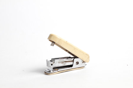 Staple remover isolated on a white background, closeup of photoの写真素材