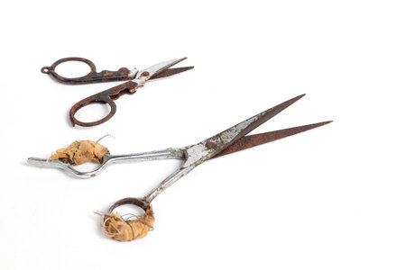 rusty used scissors isolated white background