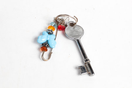 Key with colorful keychain isolated on white background. Key chain isolated on white background