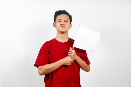 asian young man holding a blank sheet of paper over white background