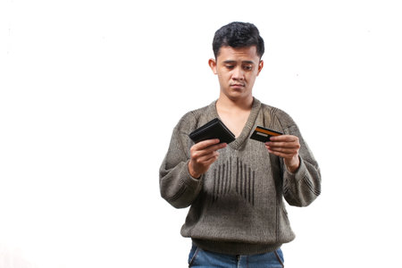 Young asian man holding a card isolated on white background.