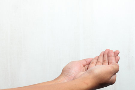 Man's hand is open as if to signal asking or giving something Isolated on white background