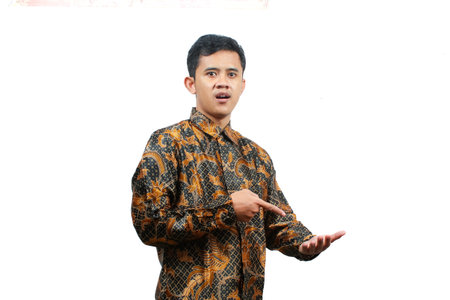 Portrait of a young asian man in traditional clothes isolated on white background