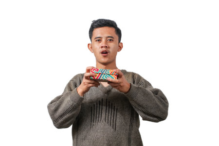 Young asian man holding gift box isolated on a white background.