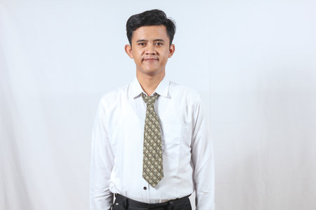 Portrait of an Asian businessman standing in a white shirt and tieの写真素材