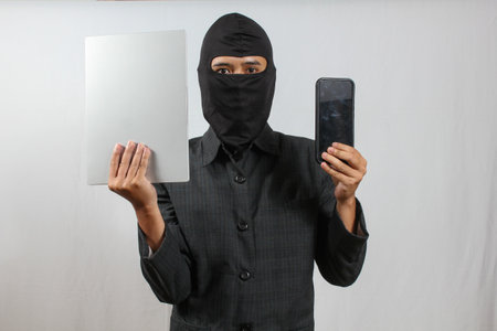 Portrait of a young man holding a smartphone