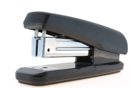 It is black a steel stapler on a white background separately one.
