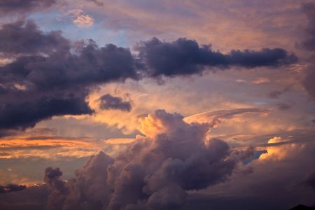 Lowering sky on a sunset after a thunder-stormの写真素材
