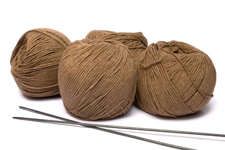 Yarn and spokes for knitting on a white background it is isolated
