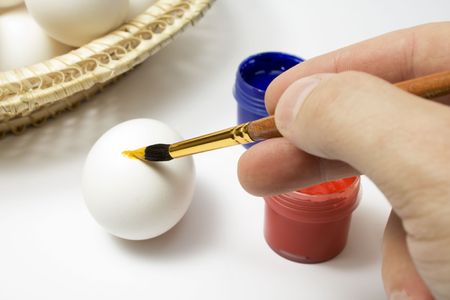 Eggs and paints, preparation for easter on whiteの写真素材