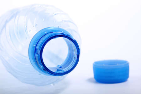 last drop of empty water bottle on white background