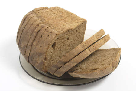 dark bread on glass plate isolated on white