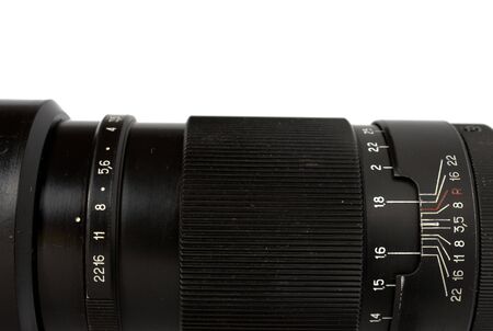 Part of Objective from classic manual film camera on white.