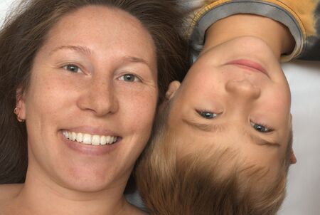 Portrait smiling mother and the son. Age of mother of 30 years. Age of the boy of 10 years.