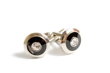a pair of stainless steel cufflinks on whiteの写真素材