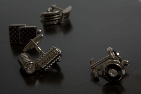 stainless steel cufflinks on the black backgroundの写真素材