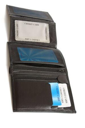 opened black leather wallet with credit cards isolated on whiteの写真素材