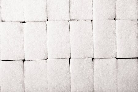 background with lump sugar on the black の写真素材