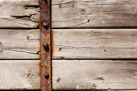 Old wooden brown wall from boardsの写真素材