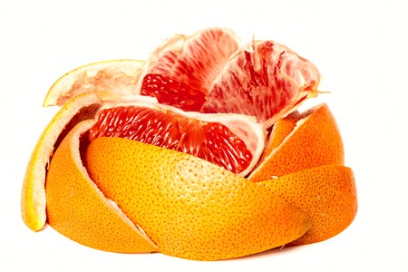 fresh red grapefruit isolated on white backgroundの写真素材