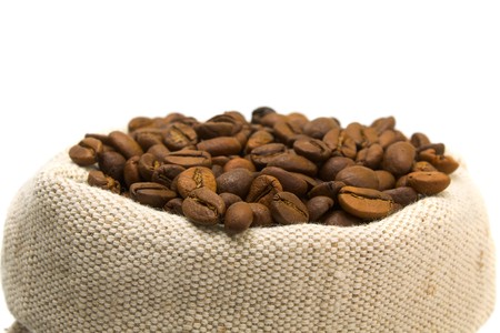 coffee beans and burlap sack isolated on whiteの写真素材