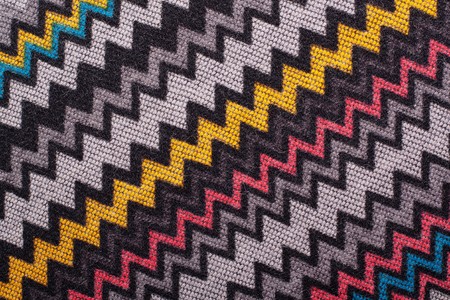 knitted woolen yarn ornament in the form of colorful waves